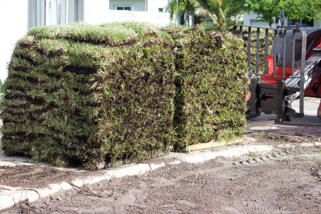 Sod on pallets, delivered by tractor to residential address for placement